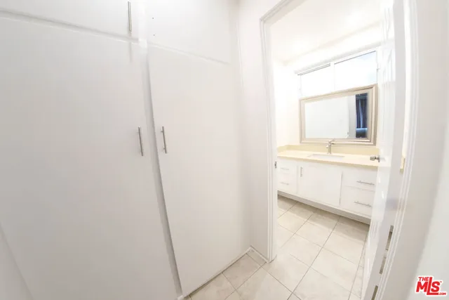 a bathroom with a sink a mirror and a bathtub