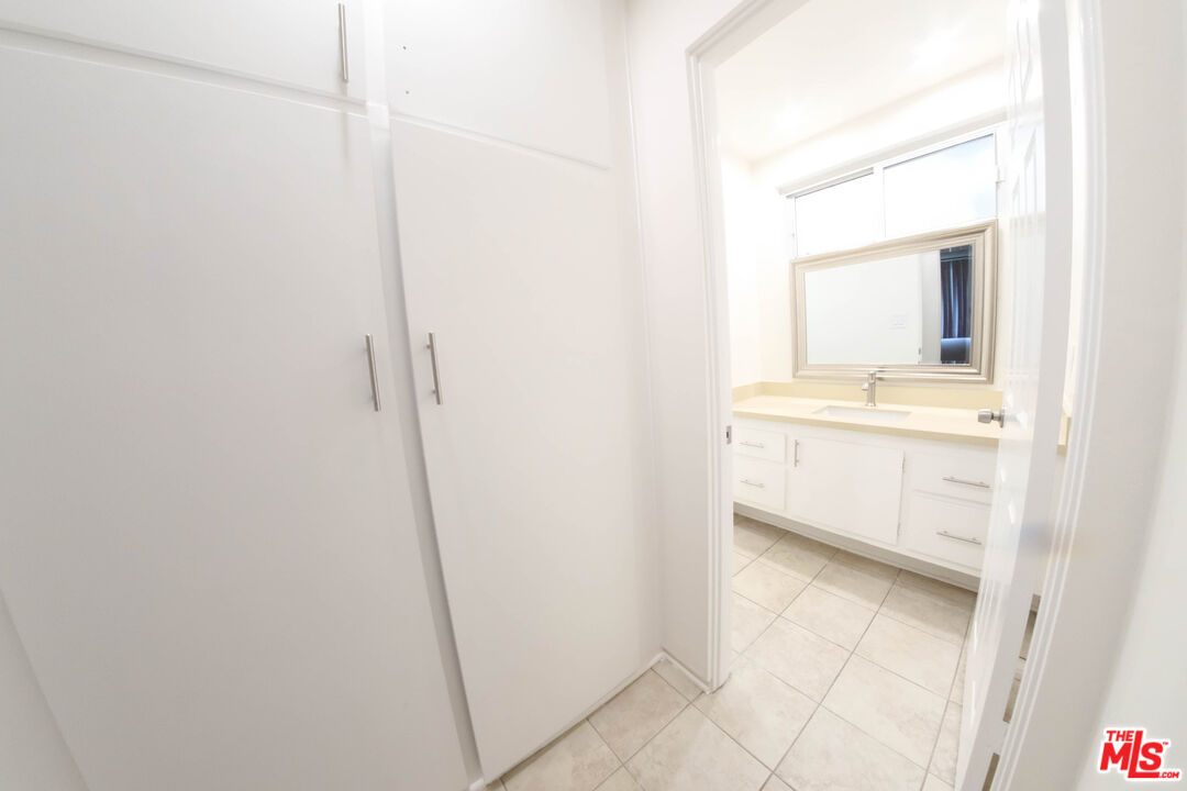 7758 West 91st Street, Unit 2 Playa del Rey, CA 90293 - Photo 22 of 24 a bathroom with a sink a mirror and a bathtub