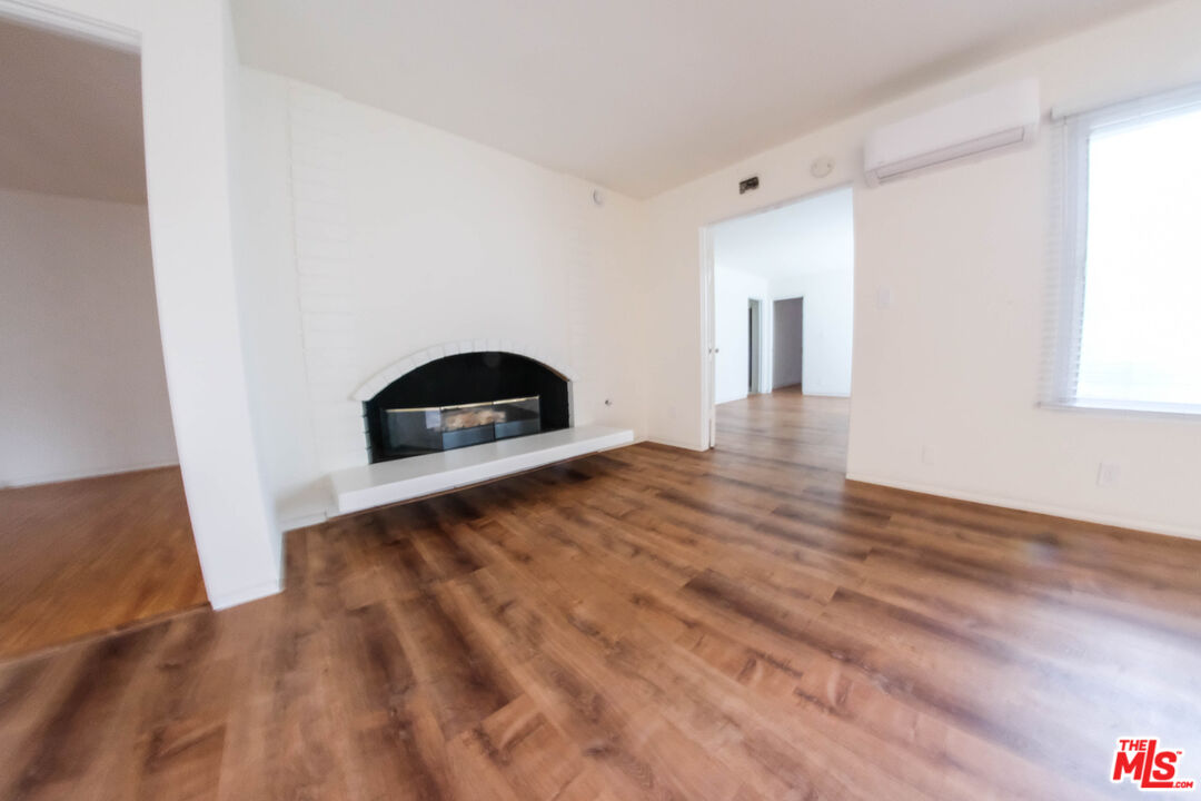 7758 West 91st Street, Unit 2 Playa del Rey, CA 90293 - Photo 4 of 24 a view of a livingroom with wooden floor and a window