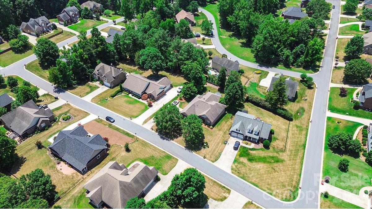 783 Sloan Street Denver, NC 28037 - Photo 40 of 44 an aerial view of a house with a garden and swimming pool