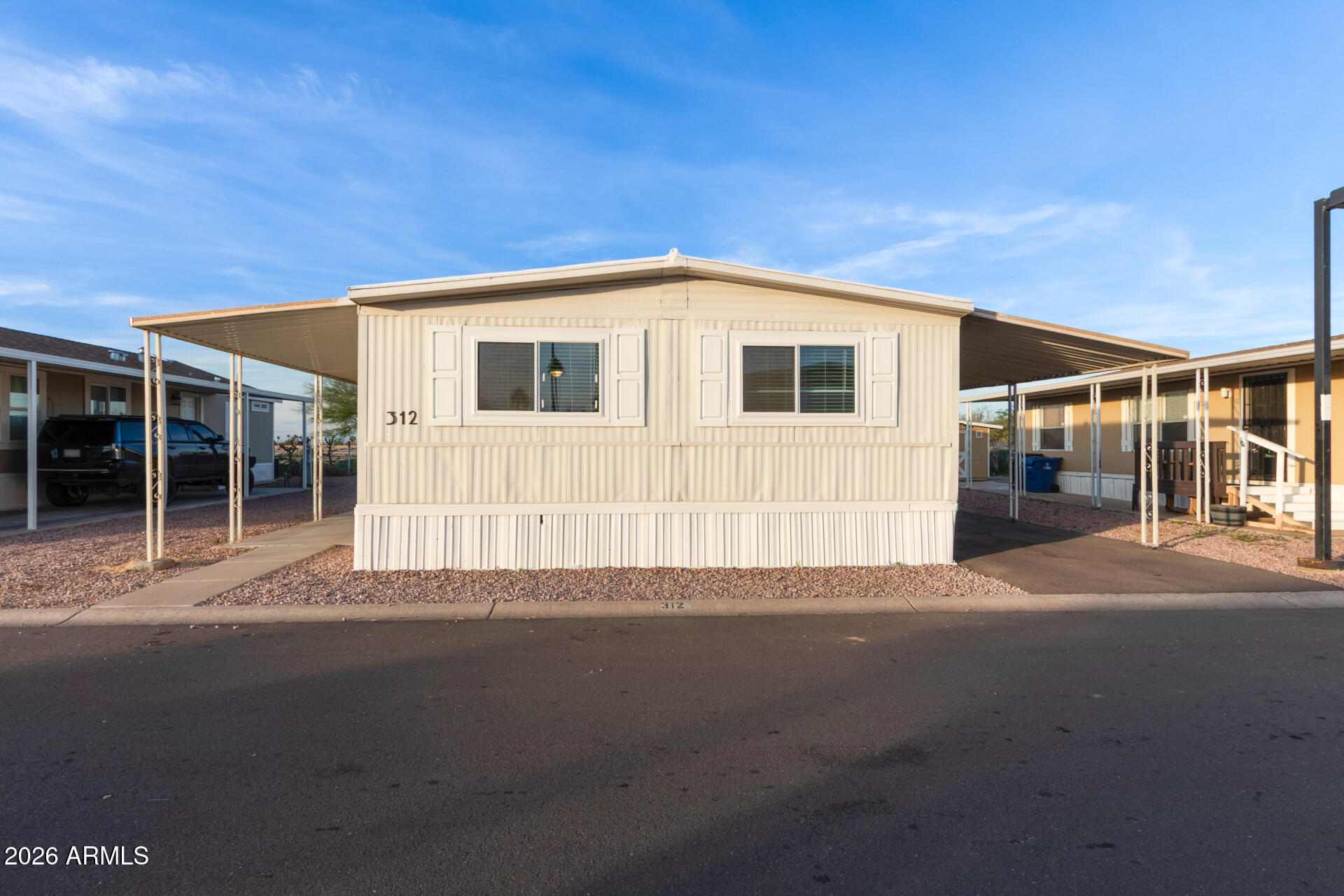 400 West Baseline Road, Unit 312 Tempe, AZ 85283 - Photo 6 of 32 a front view of a house with a yard