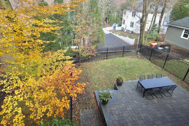 a view of a backyard with sitting area