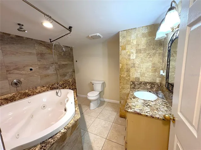 a bathroom with a sink and toilet