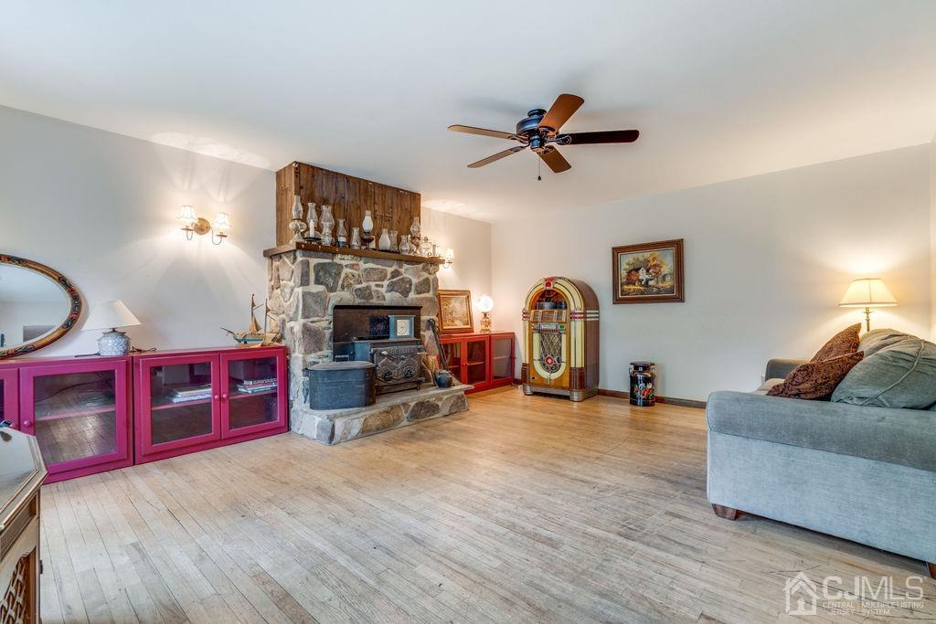 670 Ridge Road Monmouth Junction, NJ 08852 - Photo 8 of 26 a living room with furniture and a fireplace