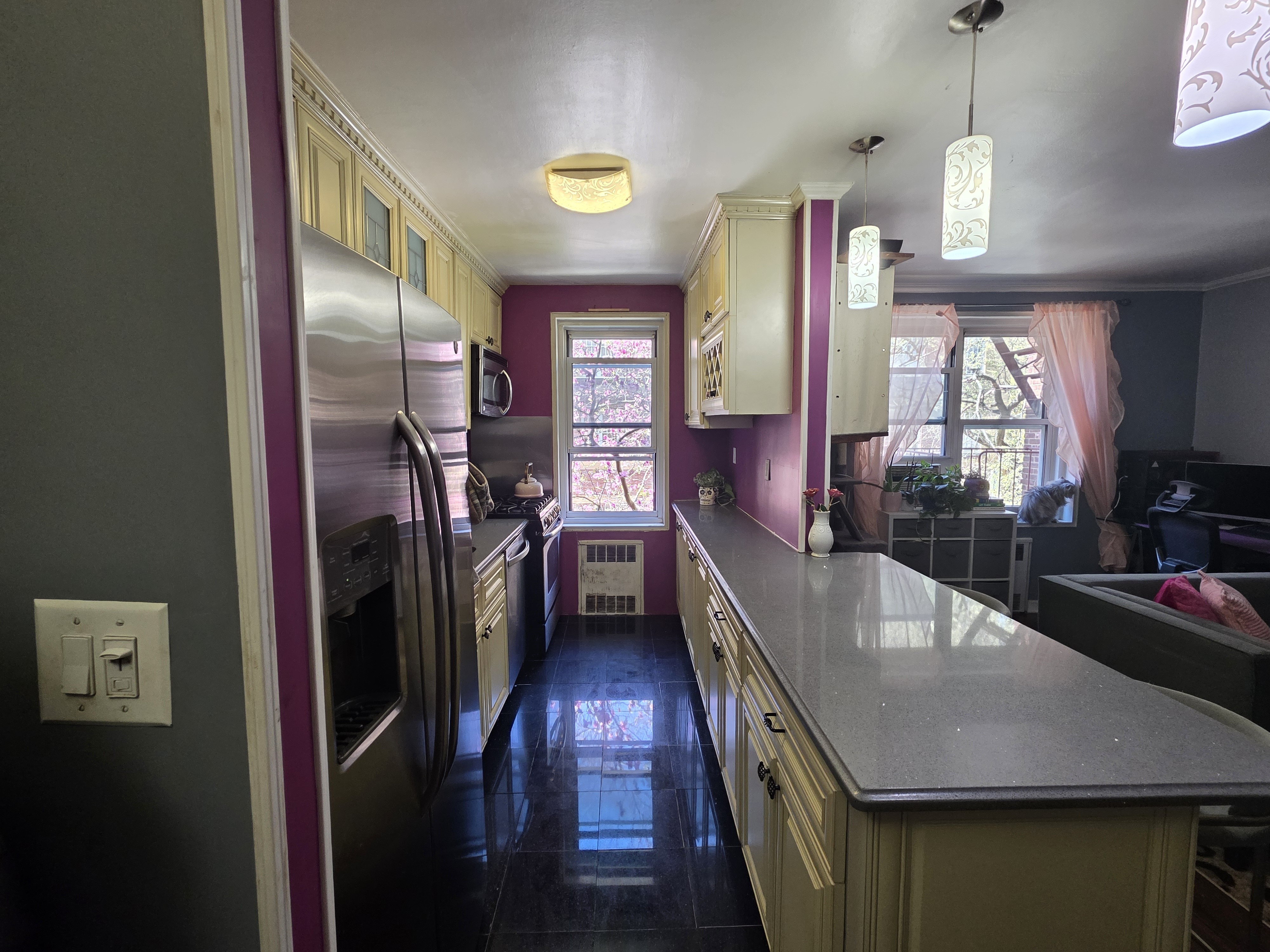 Undisclosed Address Queens, NY 11372 - Photo 8 of 9 a view of a hallway with furniture and window