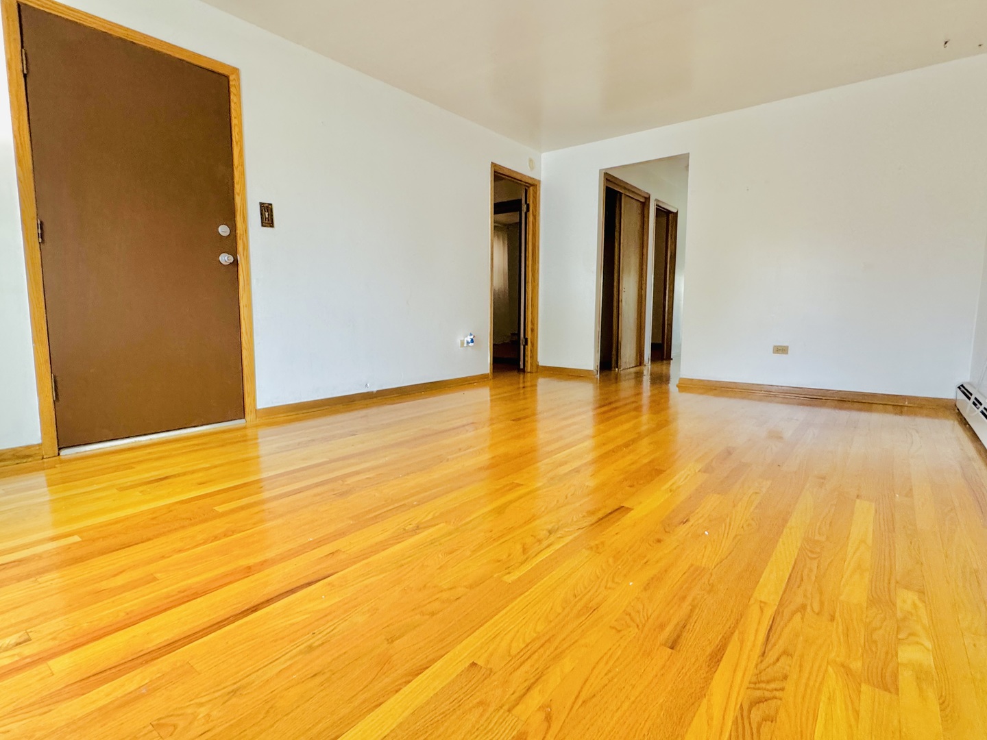 4211 West 63rd Street, Unit 1 Chicago, IL 60629 - Photo 3 of 13 a view of empty room with wooden floor