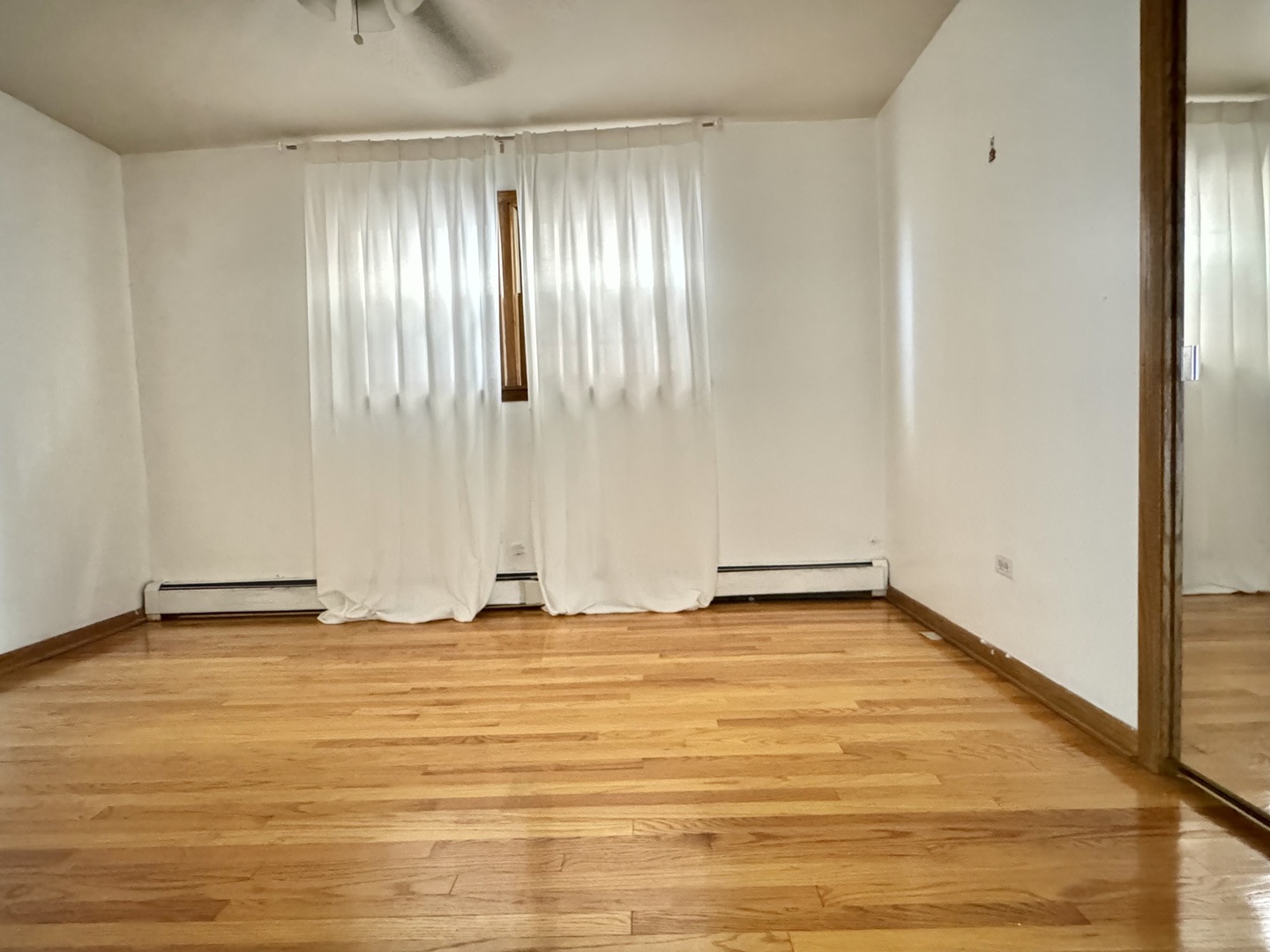 4211 West 63rd Street, Unit 1 Chicago, IL 60629 - Photo 10 of 13 a view of an empty room with wooden floor