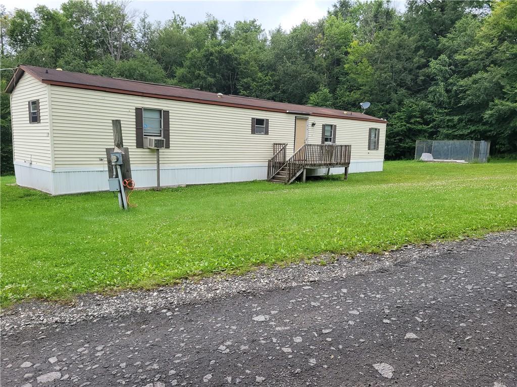 499 Tanzman Road Parksville, NY 12768 - Photo 1 of 1 a view of a house with a backyard
