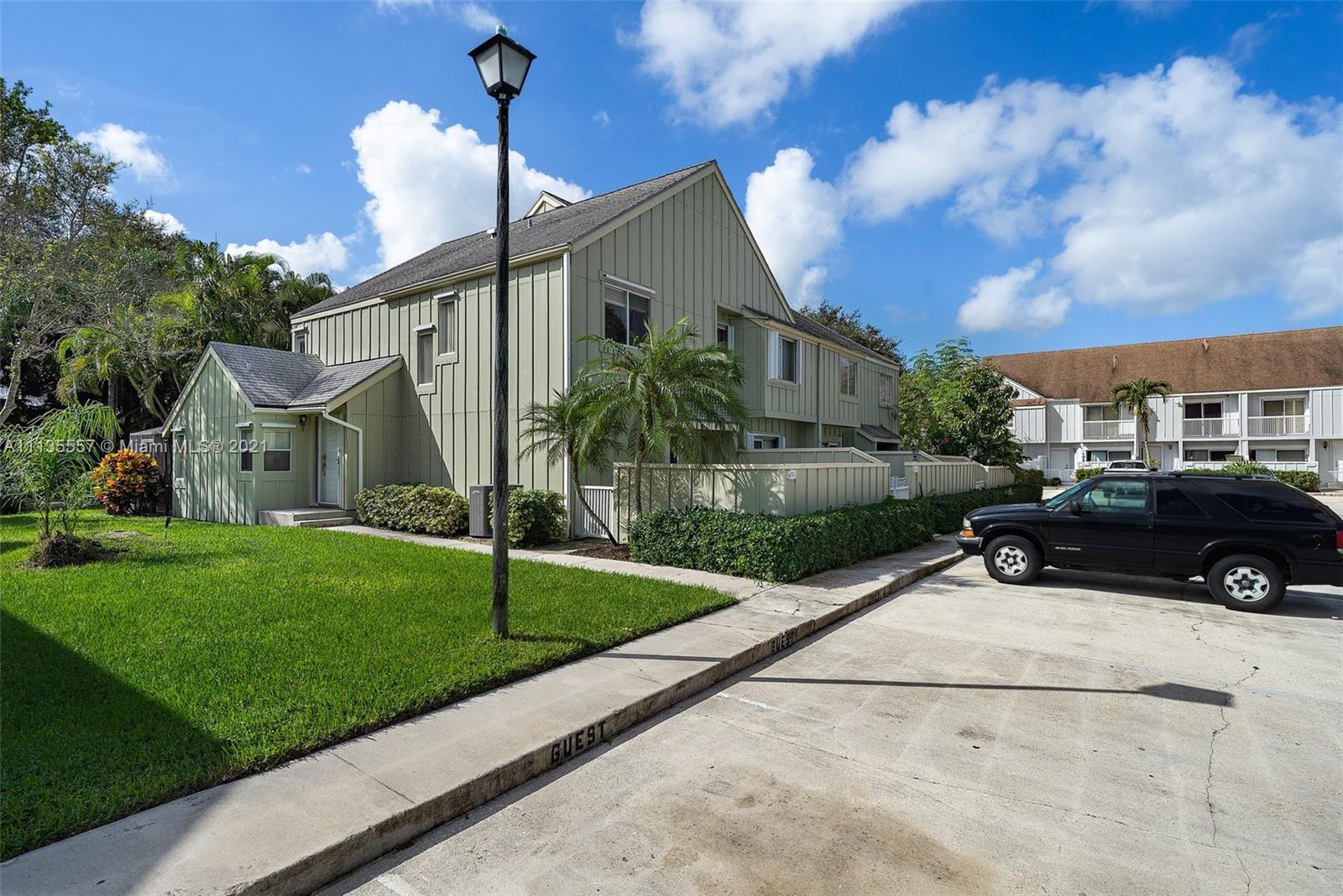 6351 Riverwalk Lane, Unit 4 Jupiter, FL 33458 - Photo 2 of 46 a view of a house in front of a house with a yard