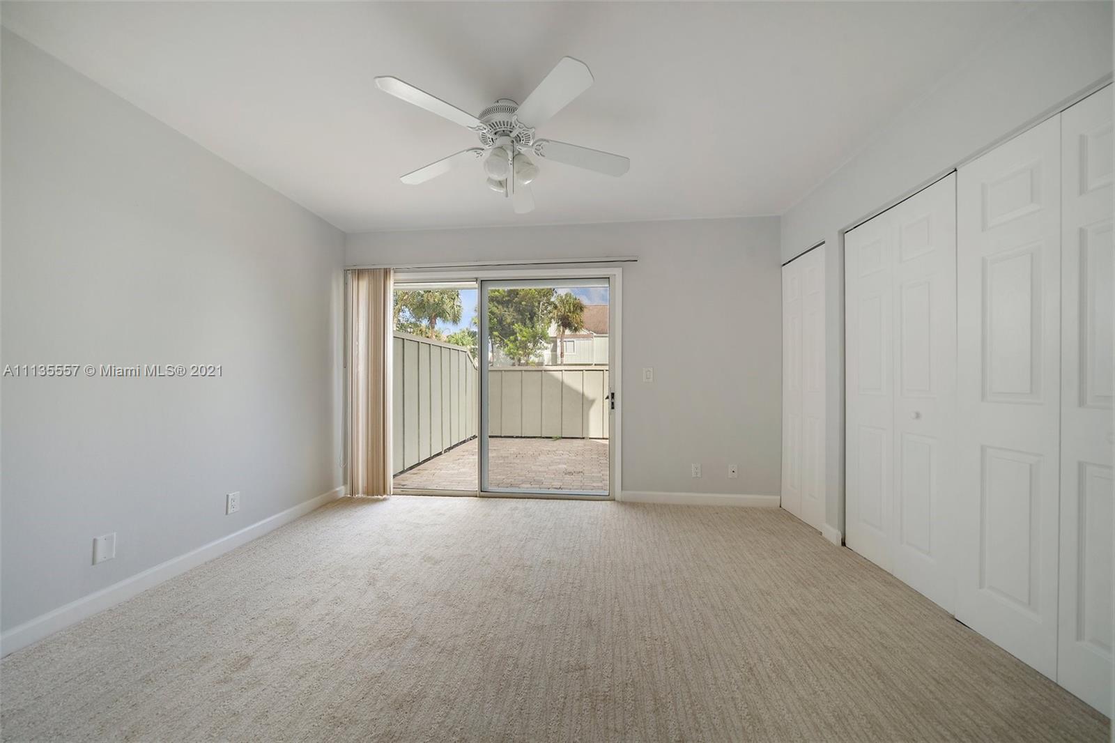 6351 Riverwalk Lane, Unit 4 Jupiter, FL 33458 - Photo 11 of 46 a view of an empty room with a window
