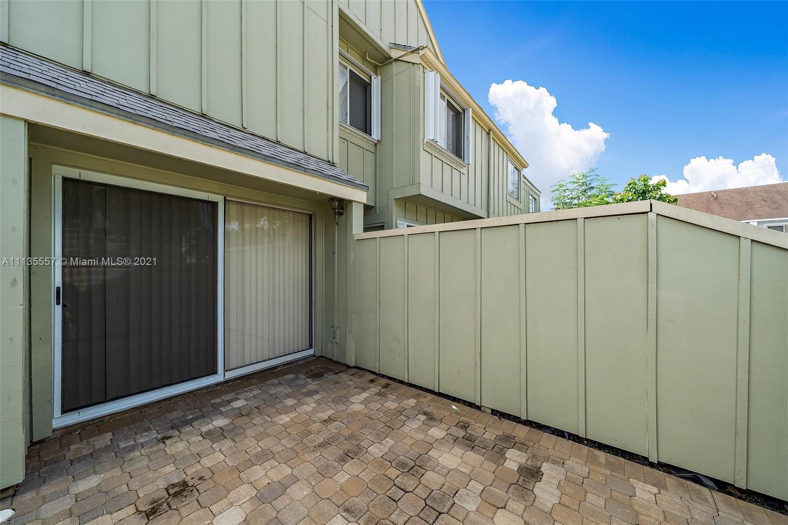 6351 Riverwalk Lane, Unit 4 Jupiter, FL 33458 - Photo 14 of 46 a view of a building with a garage