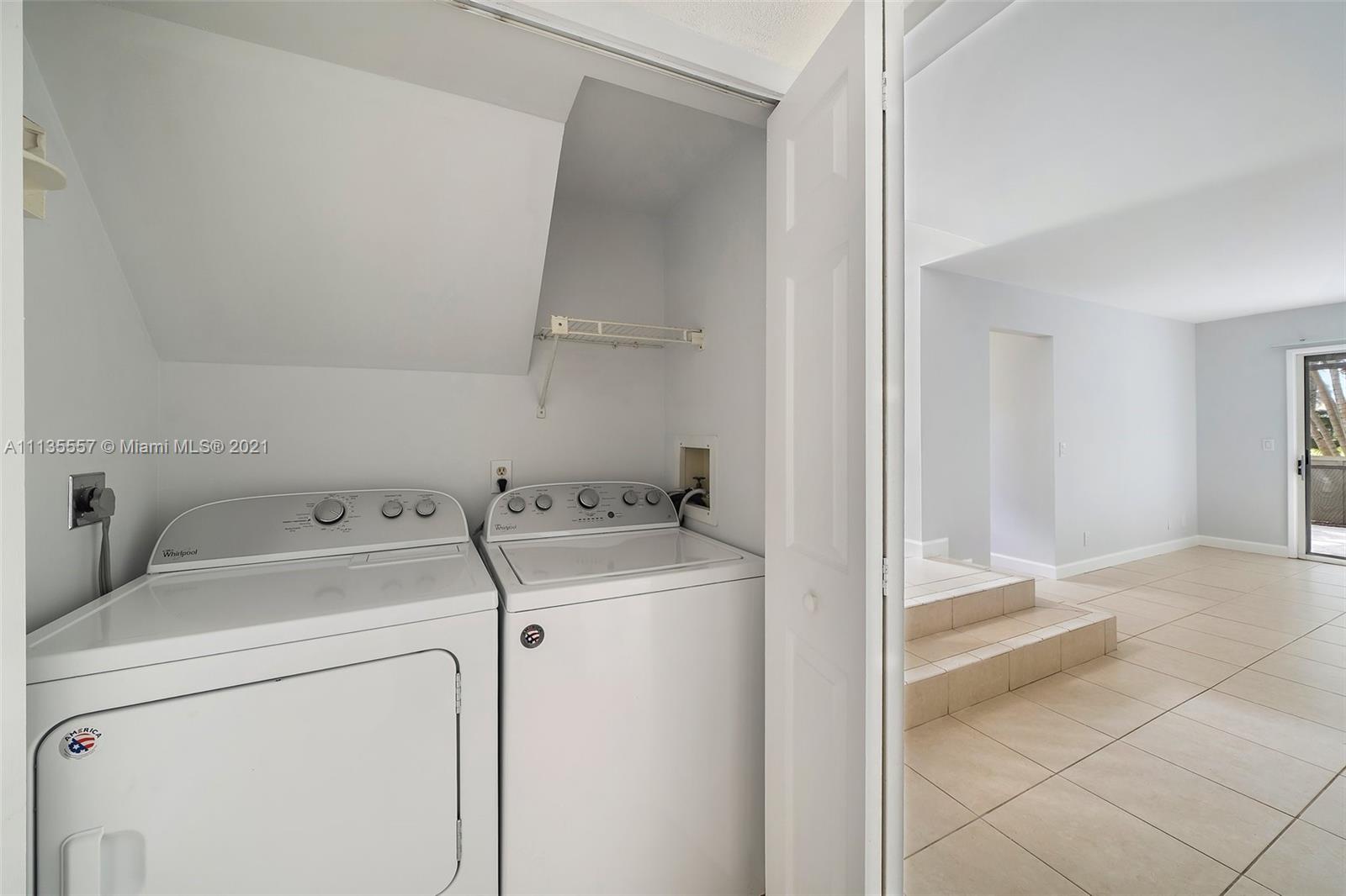 6351 Riverwalk Lane, Unit 4 Jupiter, FL 33458 - Photo 16 of 46 a view of storage and utility room with washer and dryer