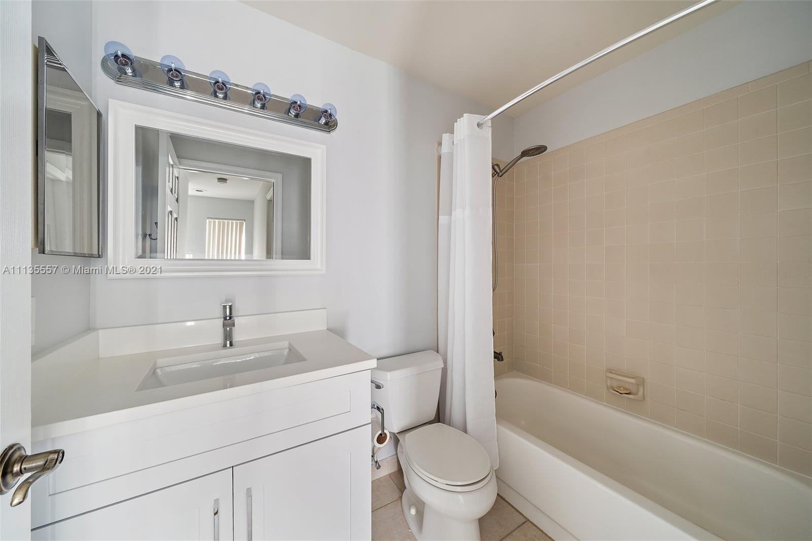 6351 Riverwalk Lane, Unit 4 Jupiter, FL 33458 - Photo 32 of 46 a bathroom with a sink toilet and shower
