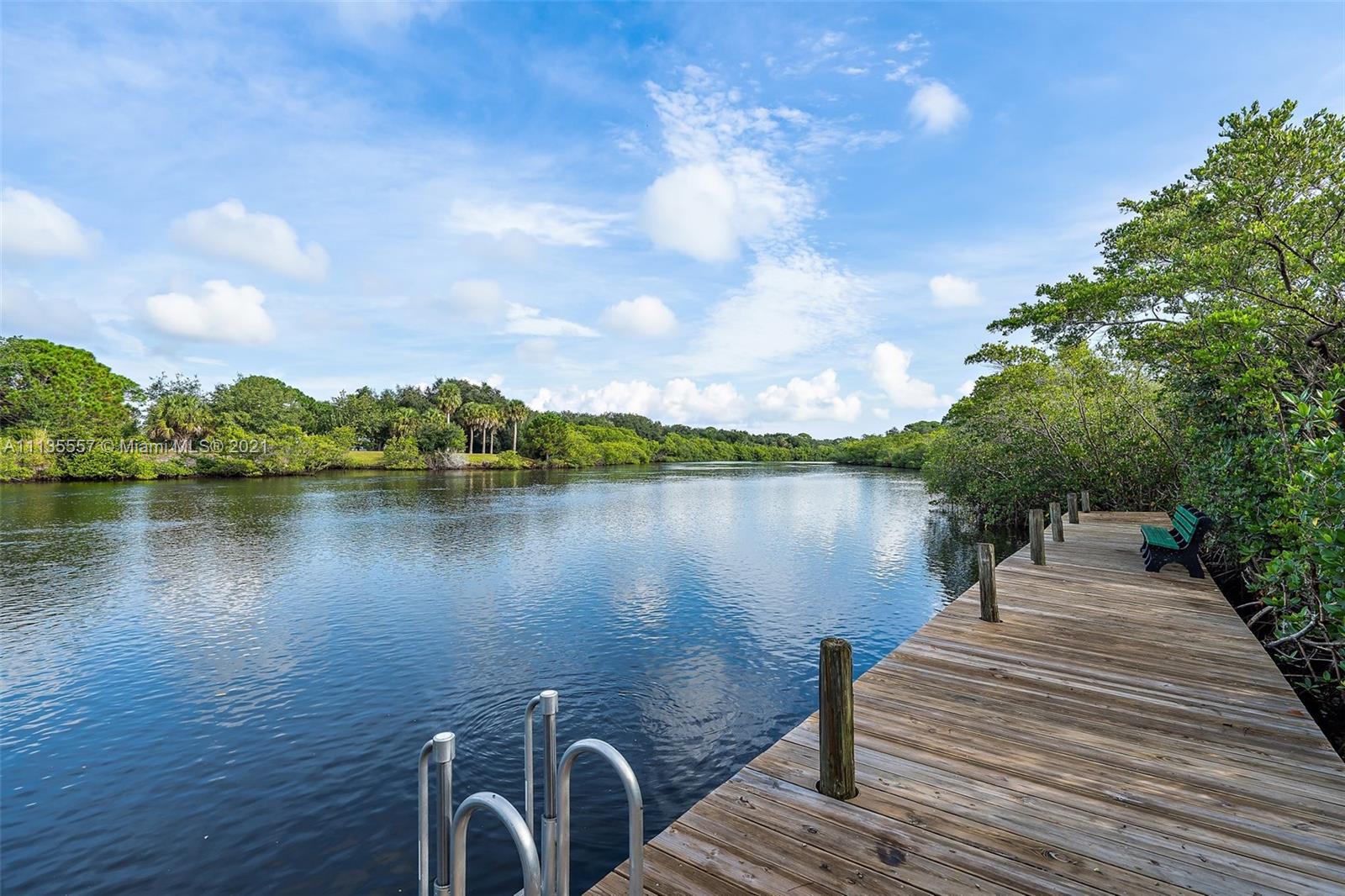 6351 Riverwalk Lane, Unit 4 Jupiter, FL 33458 - Photo 40 of 46 a lake view with a wooden floor and lake view