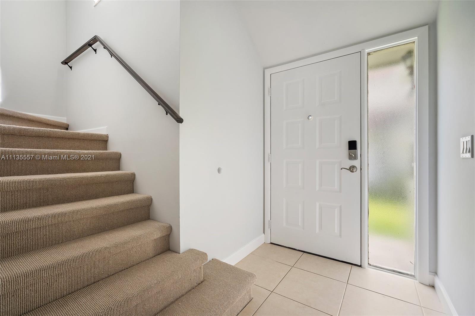 6351 Riverwalk Lane, Unit 4 Jupiter, FL 33458 - Photo 5 of 46 a view of an entryway with staircase