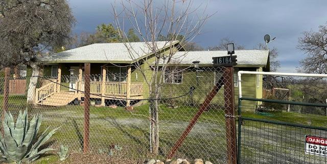 16164 Nugget Road Corning, CA 96021 - Photo 2 of 17 a backyard of a house with barbeque oven