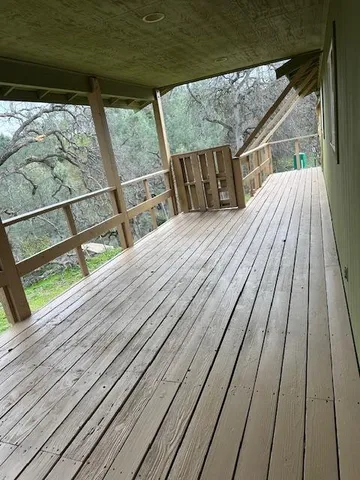a view of outdoor space with wooden floor