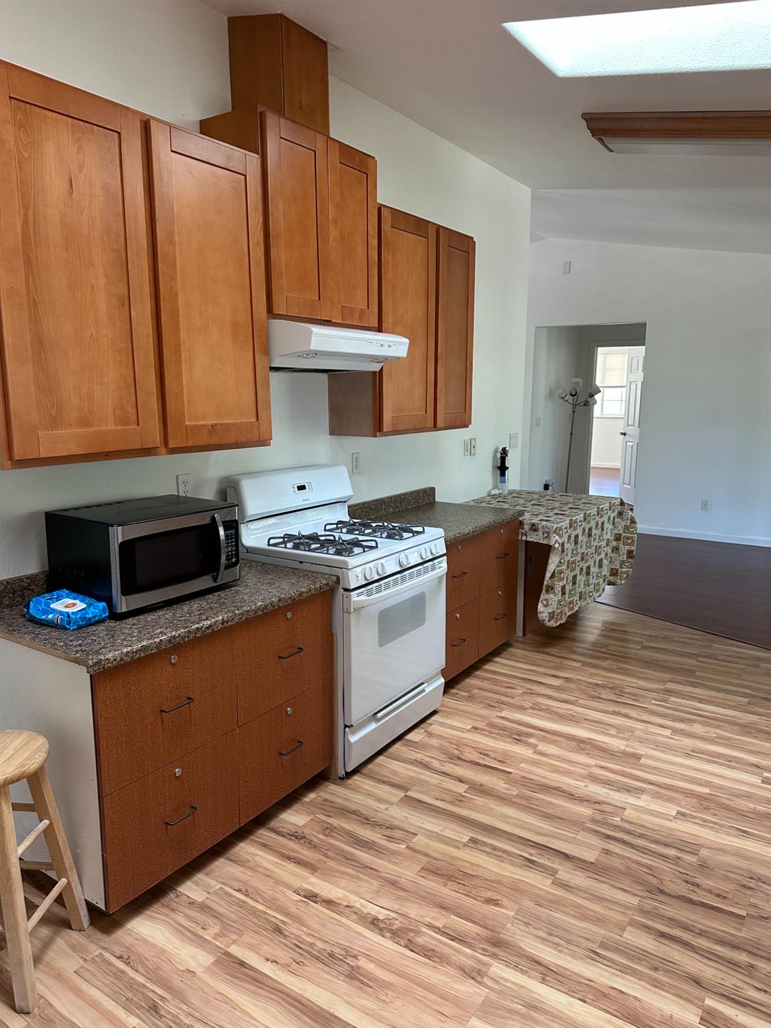 16164 Nugget Road Corning, CA 96021 - Photo 7 of 17 a kitchen with a stove a sink and a microwave