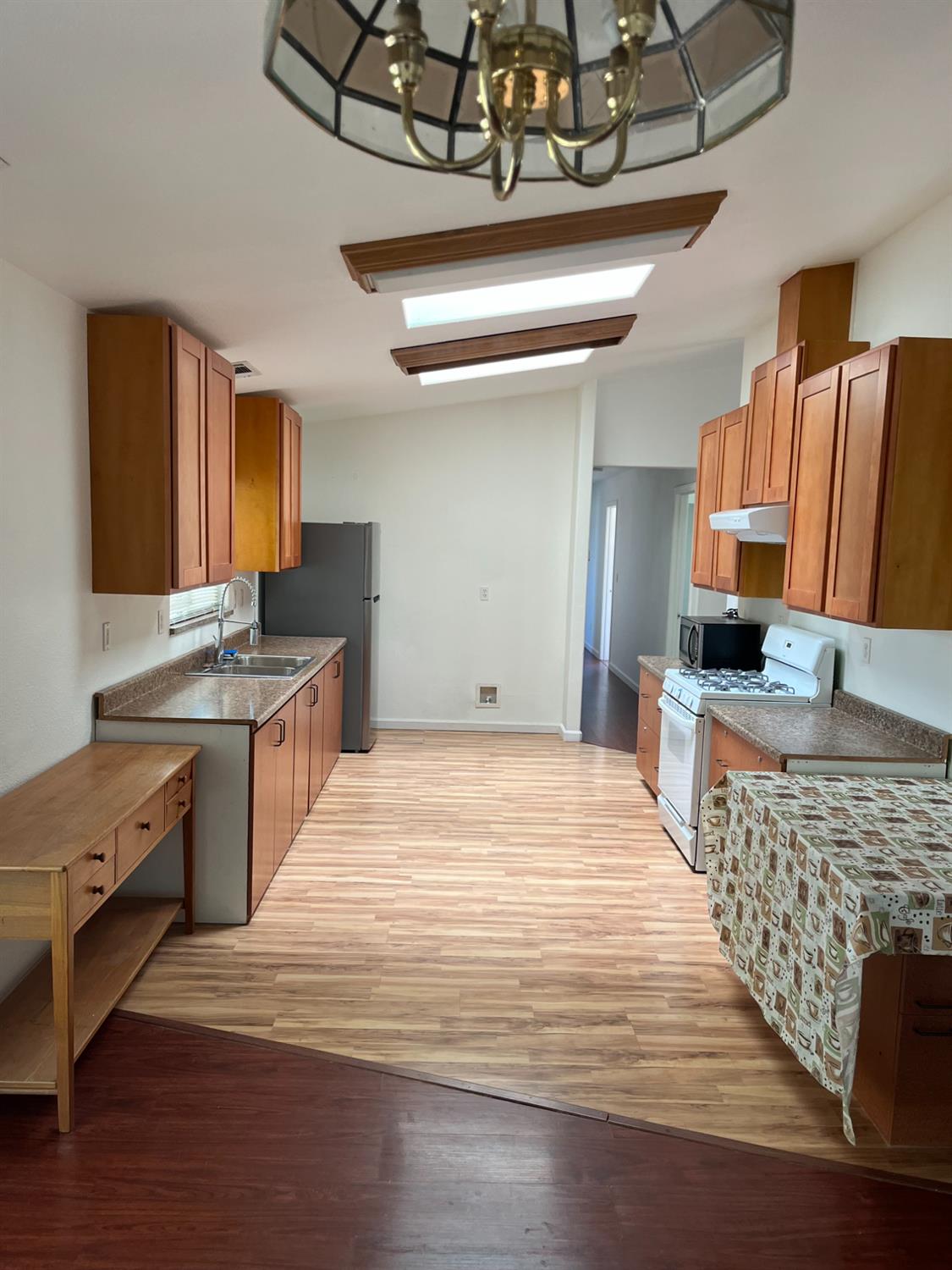 16164 Nugget Road Corning, CA 96021 - Photo 9 of 17 a large kitchen with stainless steel appliances granite countertop a stove and a sink
