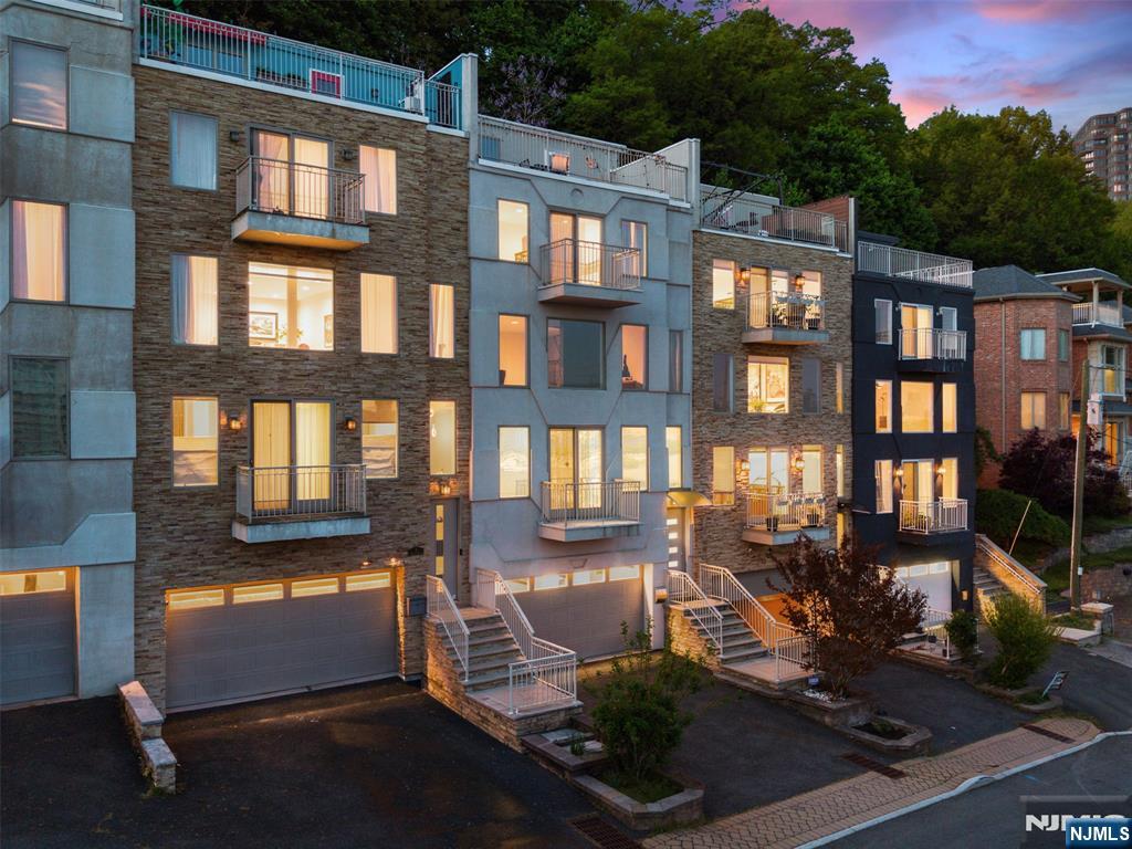 7 Oakdene Terrace, Unit 7 Edgewater, NJ 07020 - Photo 1 of 30 a front view of a building with outdoor seating