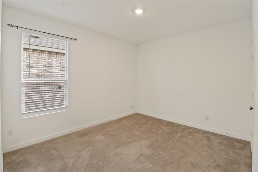 1016 Flameleaf Drive Princeton, TX 75407 - Photo 9 of 32 an empty room with a window