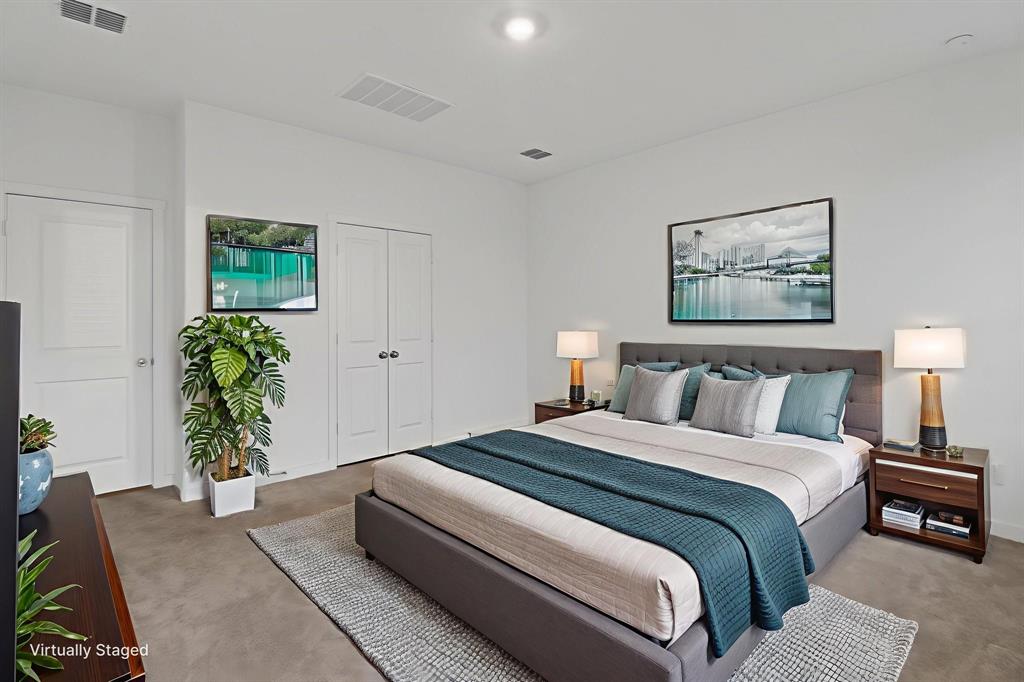 1016 Flameleaf Drive Princeton, TX 75407 - Photo 15 of 32 a bedroom with a bed and a potted plant