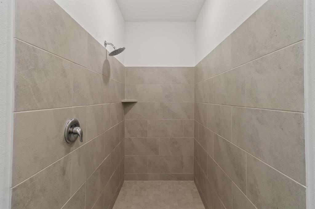 1016 Flameleaf Drive Princeton, TX 75407 - Photo 19 of 32 Bathroom with a tile shower