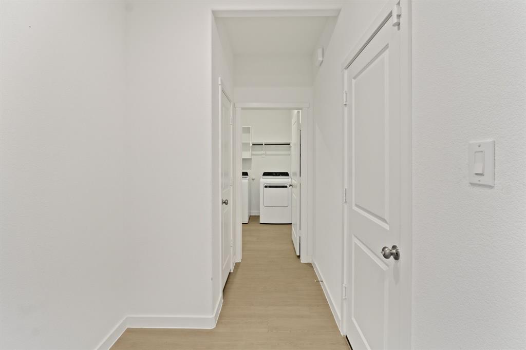 1016 Flameleaf Drive Princeton, TX 75407 - Photo 21 of 32 a view of a hallway with white walls