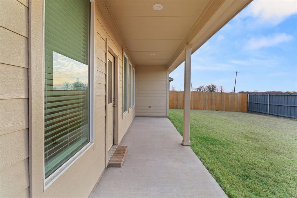 1016 Flameleaf Drive Princeton, TX 75407 - Photo 22 of 32 Fenced backyard with a patio area