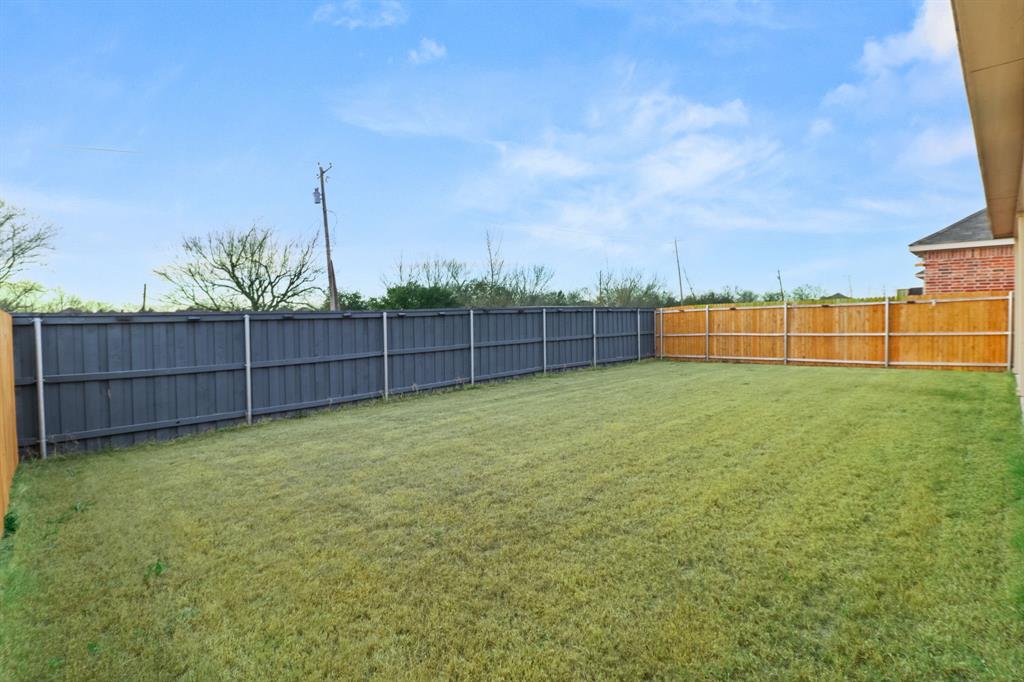 1016 Flameleaf Drive Princeton, TX 75407 - Photo 25 of 32 View of fenced backyard