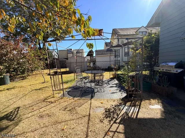 a view of a patio with swimming pool table and chairs