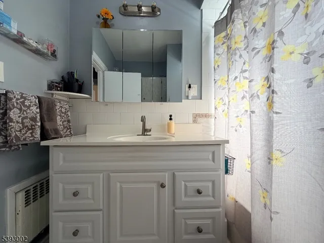 a bathroom with a sink a vanity and a mirror