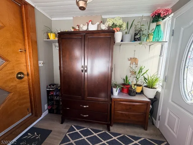 a room with a table and potted plants