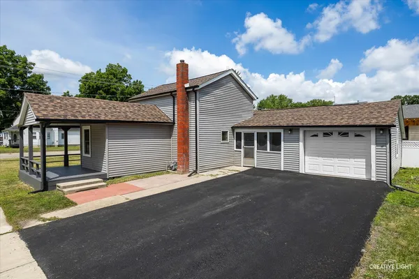 a front view of a house with a garage