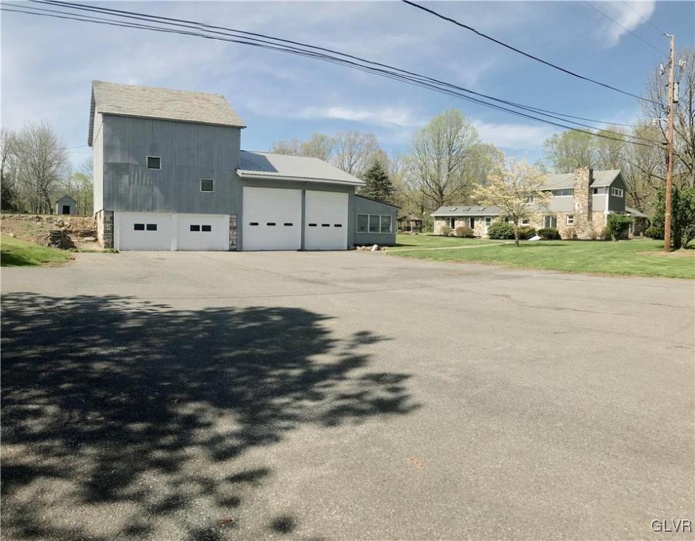 View from parking lot of the Barn, Garage, and add