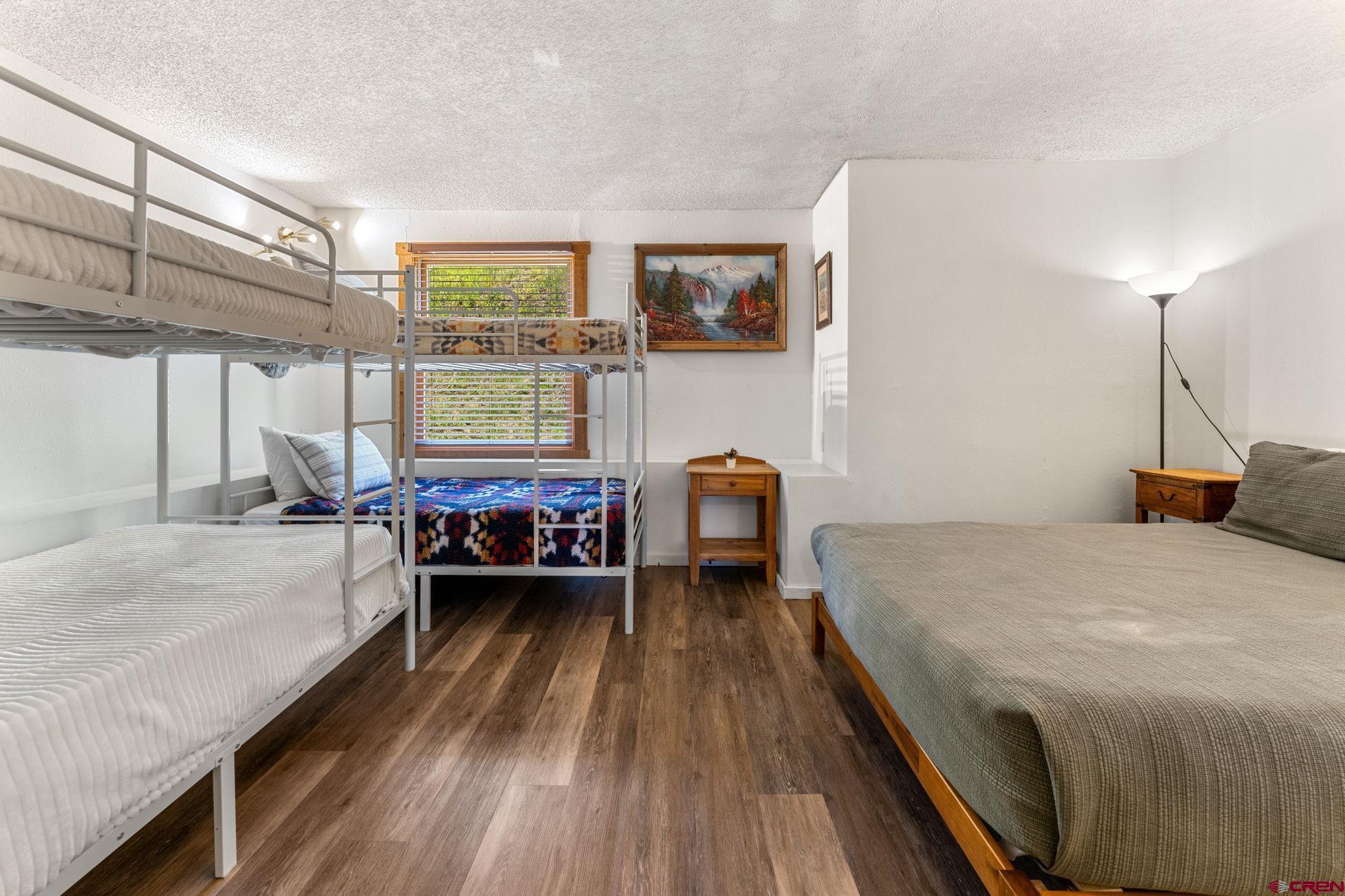 72 Hunter Hill Road, Unit I204 Crested Butte, CO 81225 - Photo 21 of 44 a bed room with a bed window and a chair