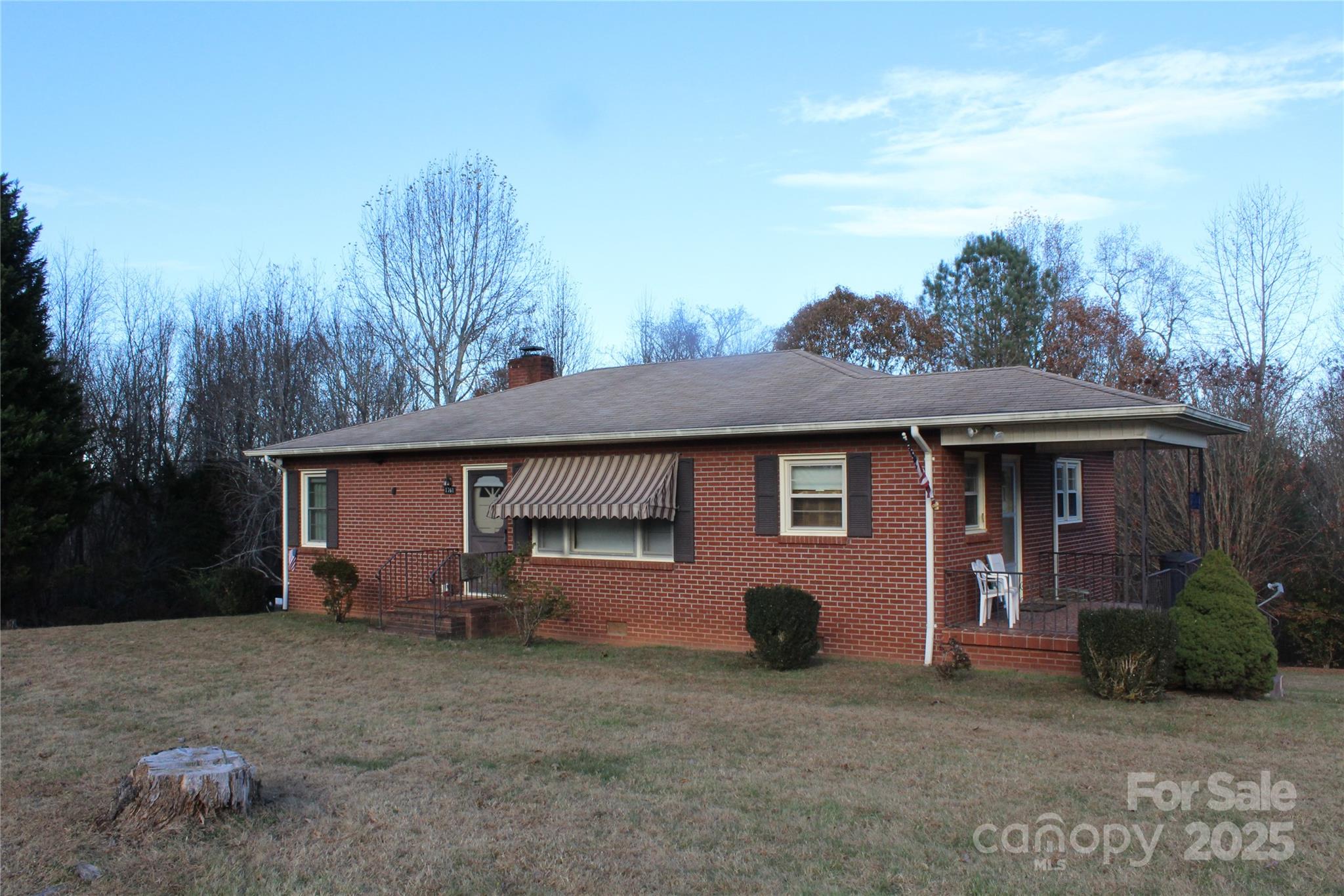 1761 Dearborn Street Morganton, NC 28655 - Photo 1 of 34 a view of a house with a yard and large tree