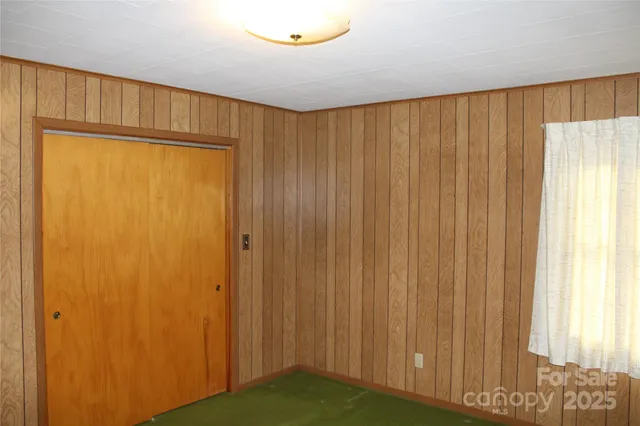 a view of a hardwood floor and cabinet