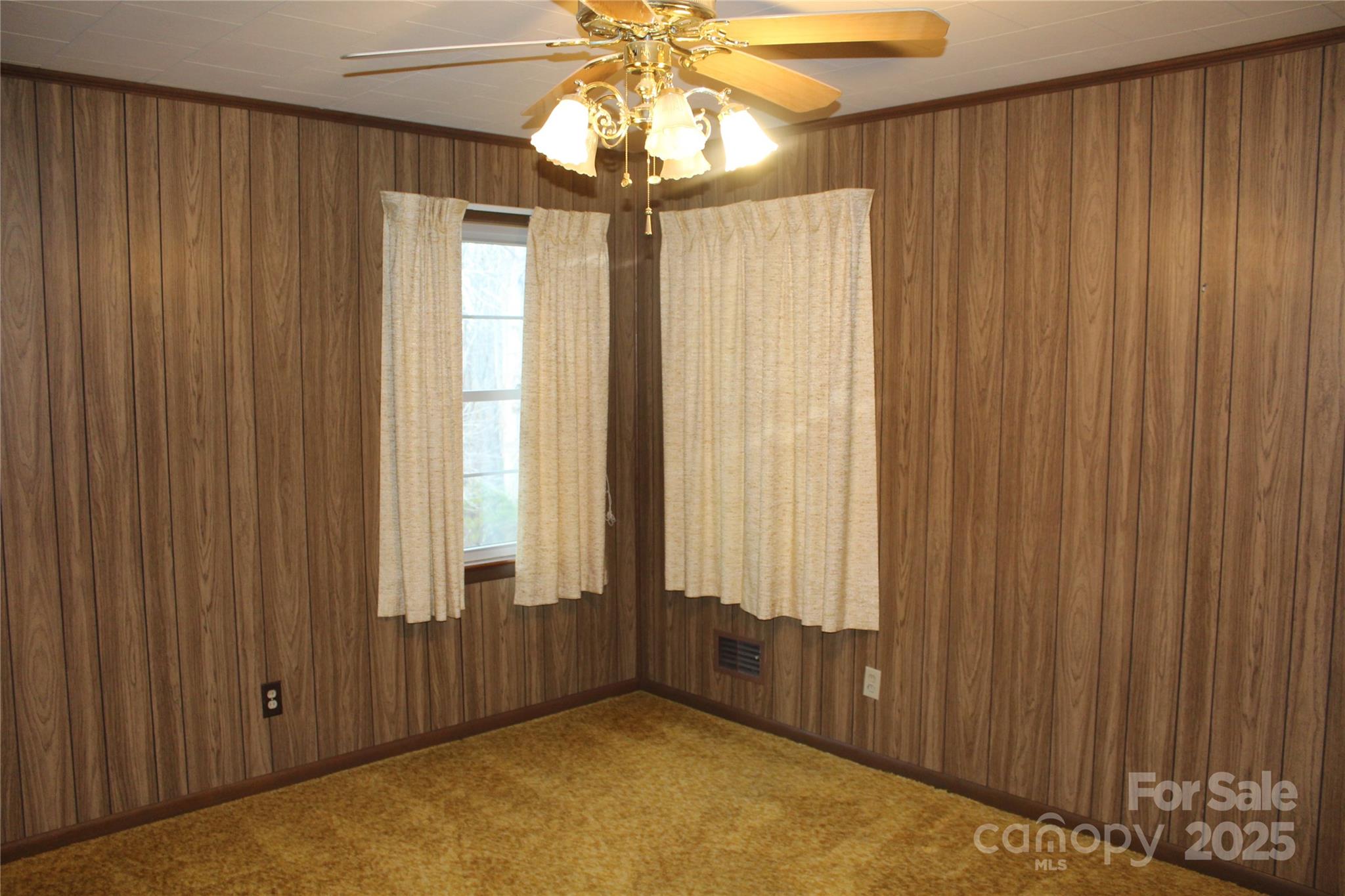 1761 Dearborn Street Morganton, NC 28655 - Photo 16 of 34 a view of a room with a window and a chandelier fan