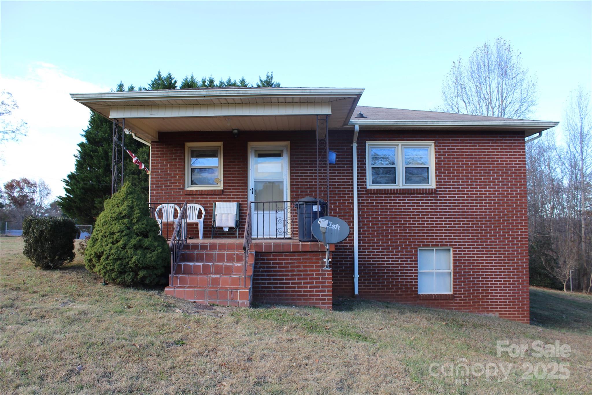 1761 Dearborn Street Morganton, NC 28655 - Photo 5 of 34 a front view of a house with garden
