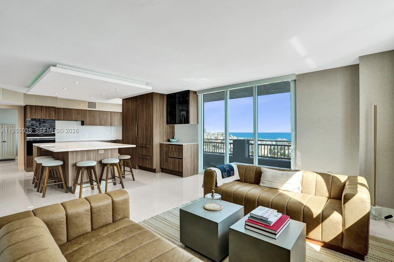 90 Alton Road, Unit 2701 Miami Beach, FL 33139 - Photo 21 of 76 a living room with furniture and a large window