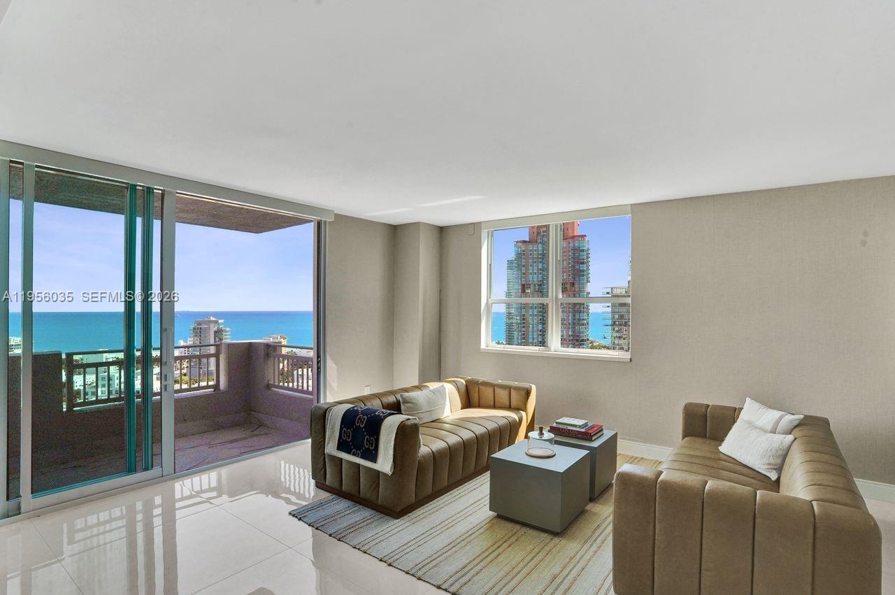 90 Alton Road, Unit 2701 Miami Beach, FL 33139 - Photo 31 of 76 a living room with furniture and a floor to ceiling window