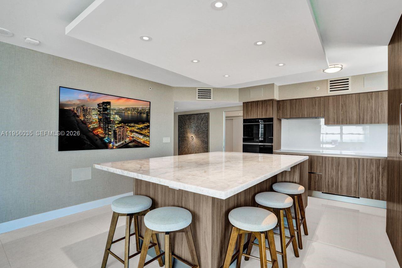 90 Alton Road, Unit 2701 Miami Beach, FL 33139 - Photo 4 of 76 a room with furniture and a screen