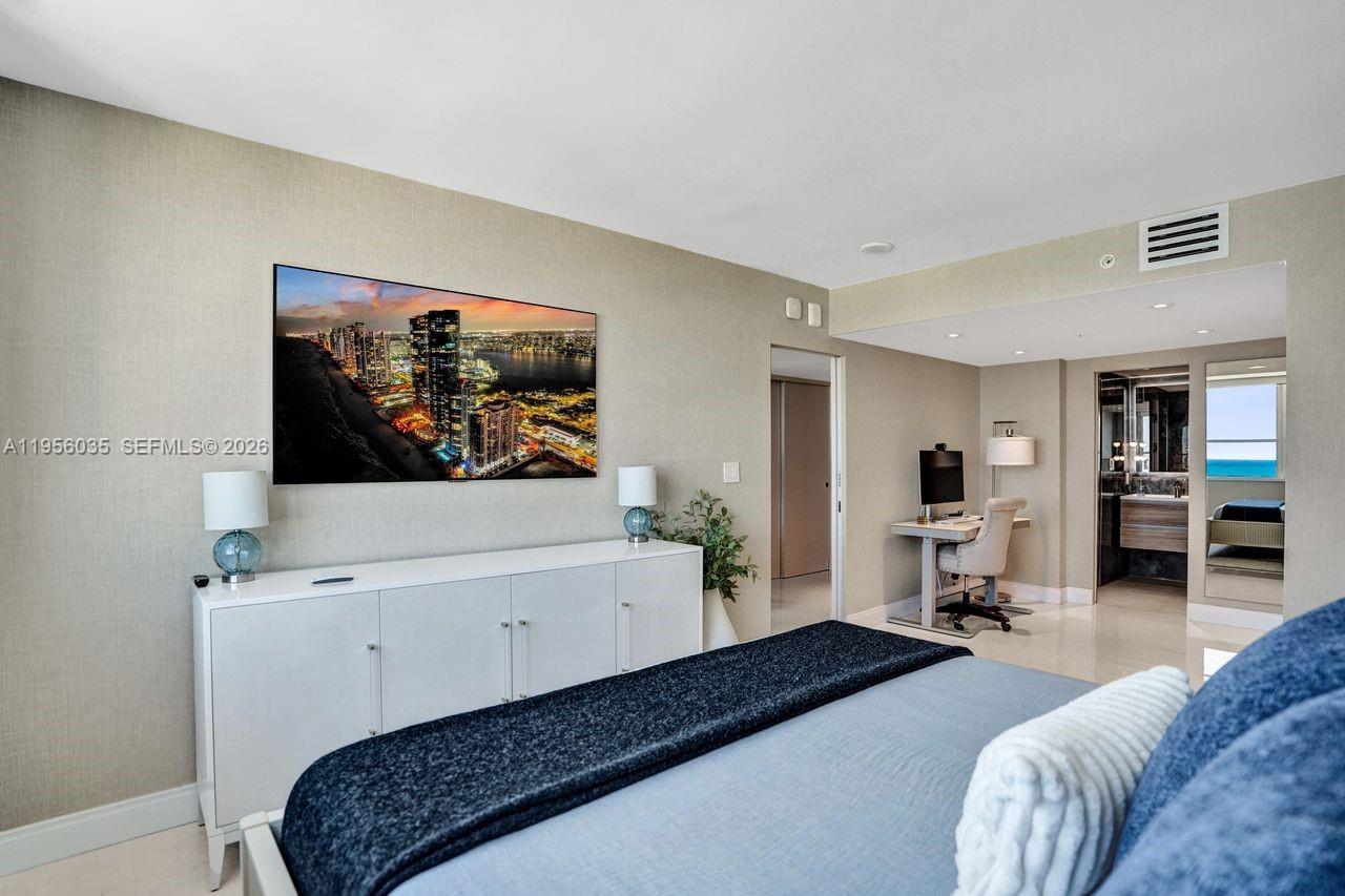 90 Alton Road, Unit 2701 Miami Beach, FL 33139 - Photo 60 of 76 a living room with furniture and a flat screen tv