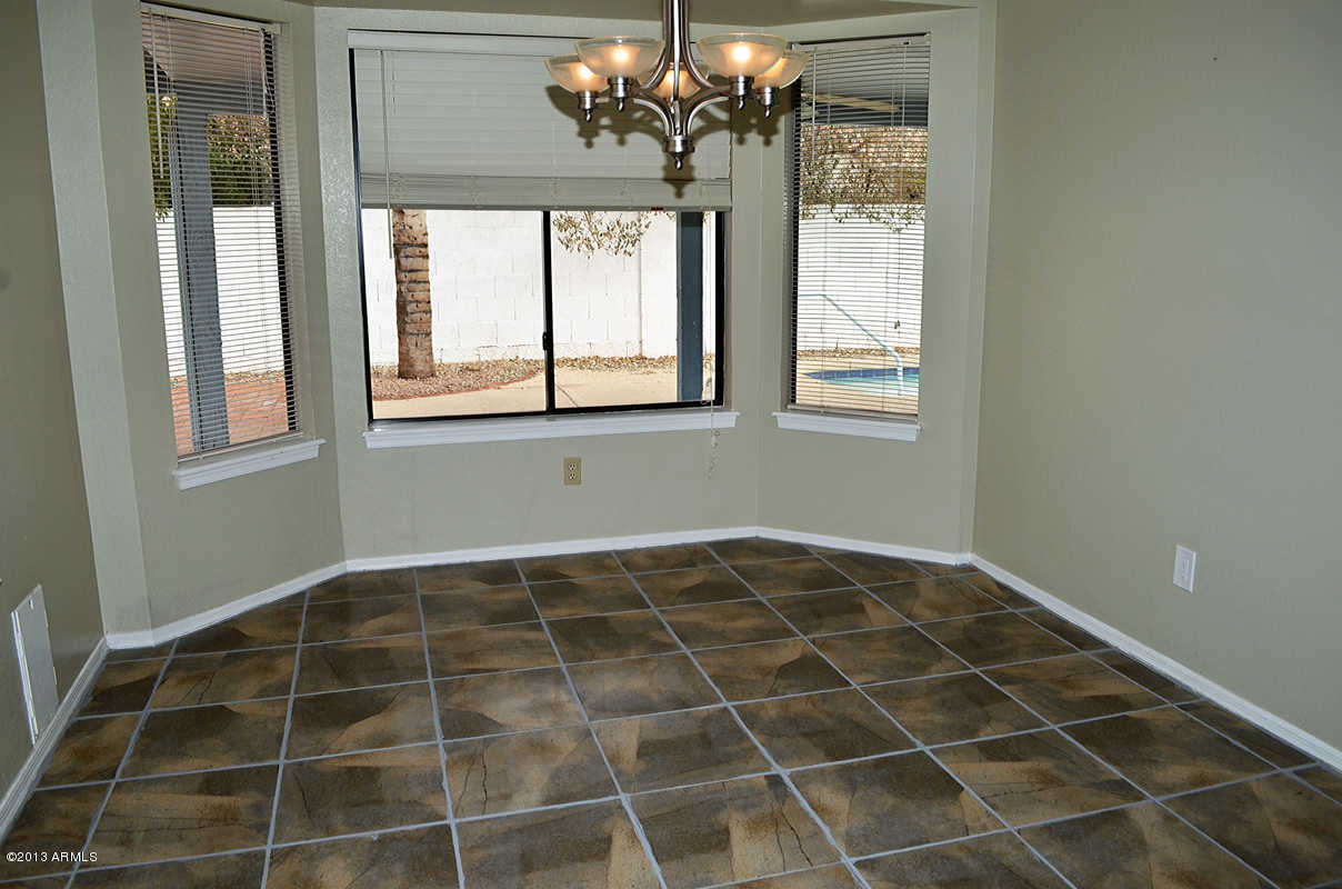 420 East Harwell Road Gilbert, AZ 85234 - Photo 5 of 13 a view of an empty room with a window
