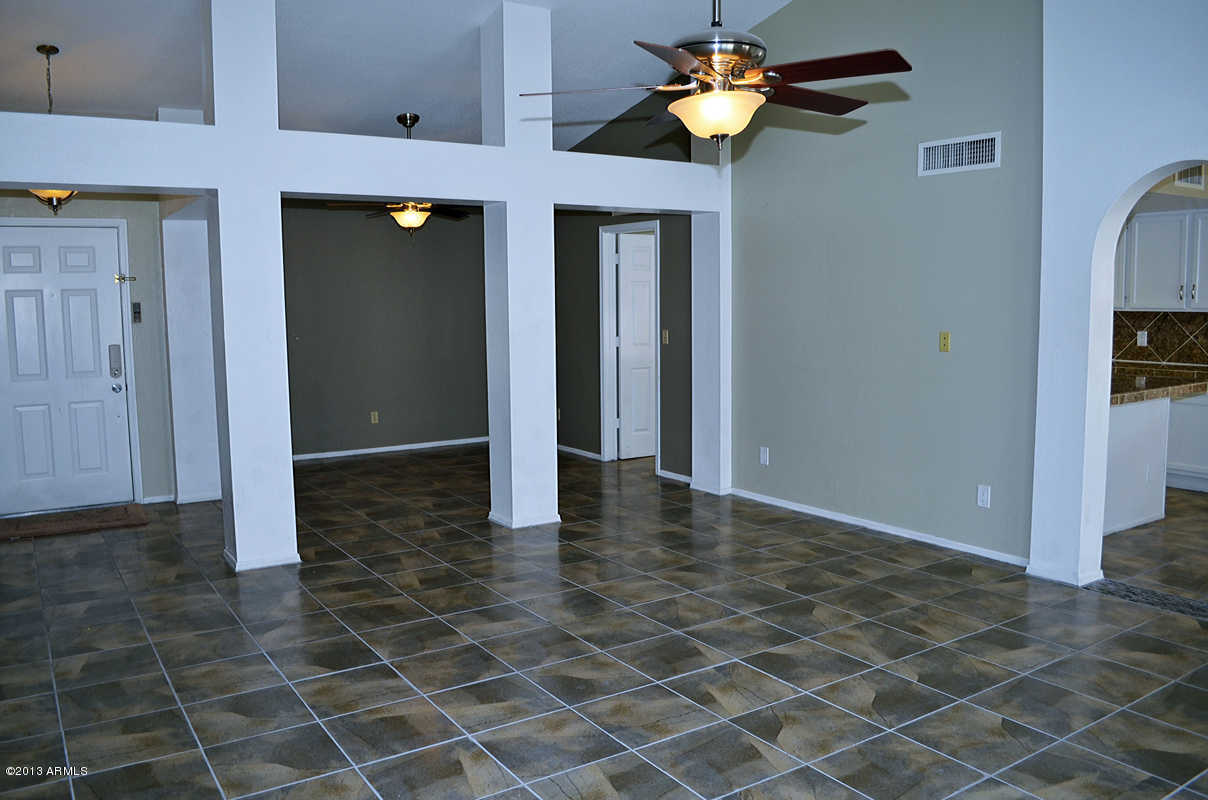 420 East Harwell Road Gilbert, AZ 85234 - Photo 7 of 13 a view of a chandelier fan and kitchen in a house