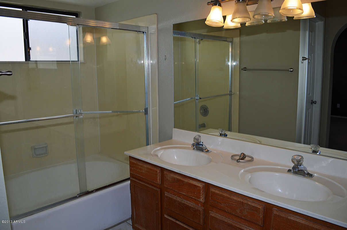 420 East Harwell Road Gilbert, AZ 85234 - Photo 9 of 13 a bathroom with a sink and a mirror