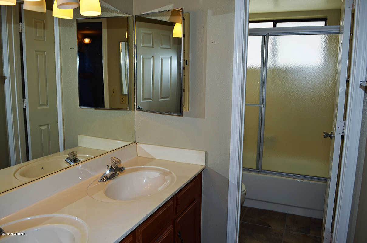 420 East Harwell Road Gilbert, AZ 85234 - Photo 10 of 13 a bathroom with a sink and mirror