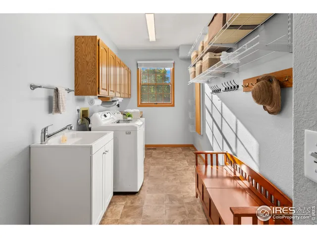a utility room with two washing machine