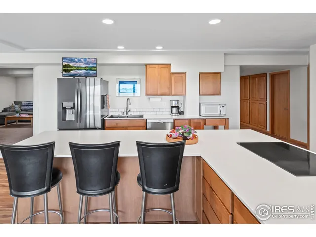 a kitchen with a table and chairs